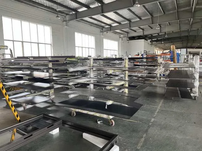 Metal door panels and frames in the KEST Door production workshop.